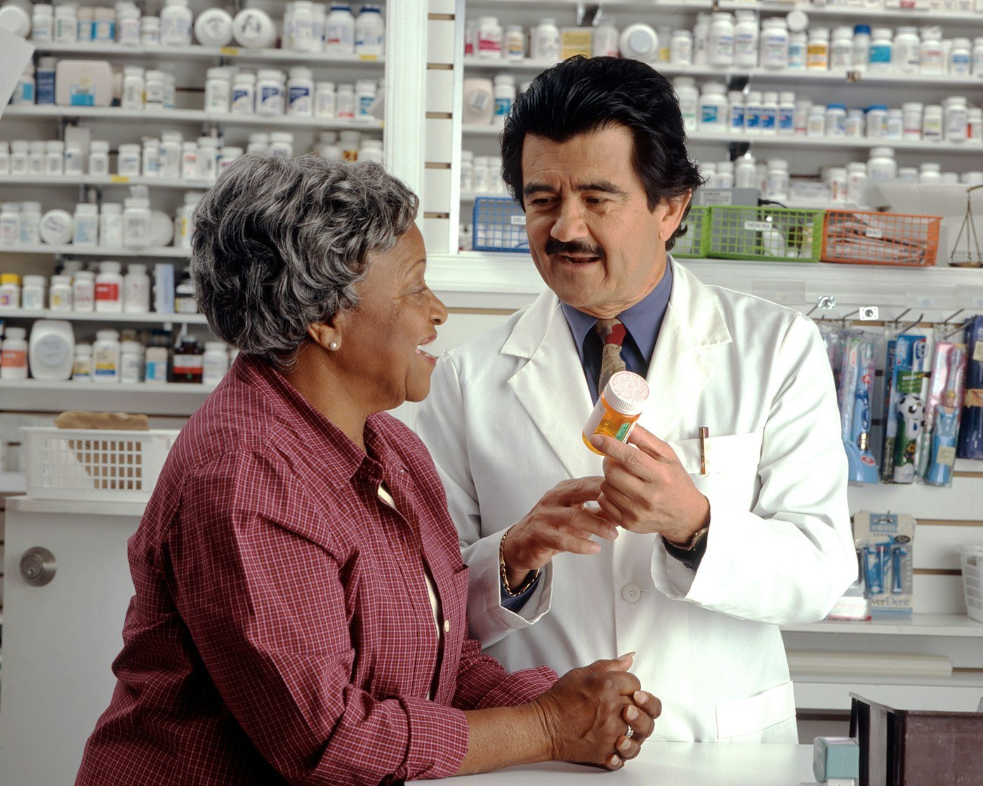 AI medication management with a pharmacist reviewing prescription information